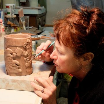 Ceramic artist Helen Purdum working in her Grovewood Village studio in Asheville.