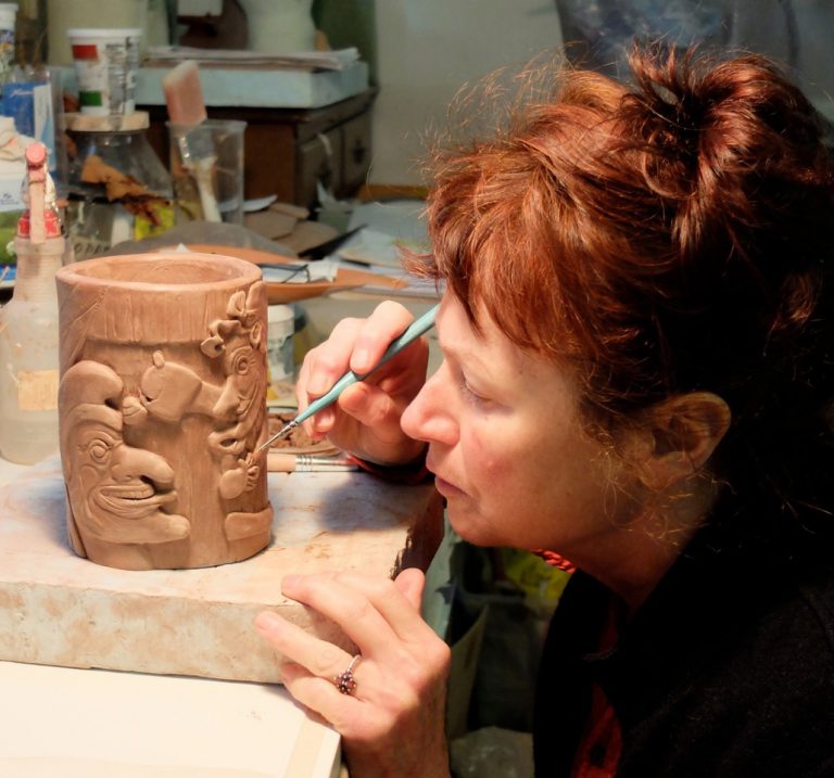 Ceramic artist Helen Purdum working in her Grovewood Village studio in Asheville.
