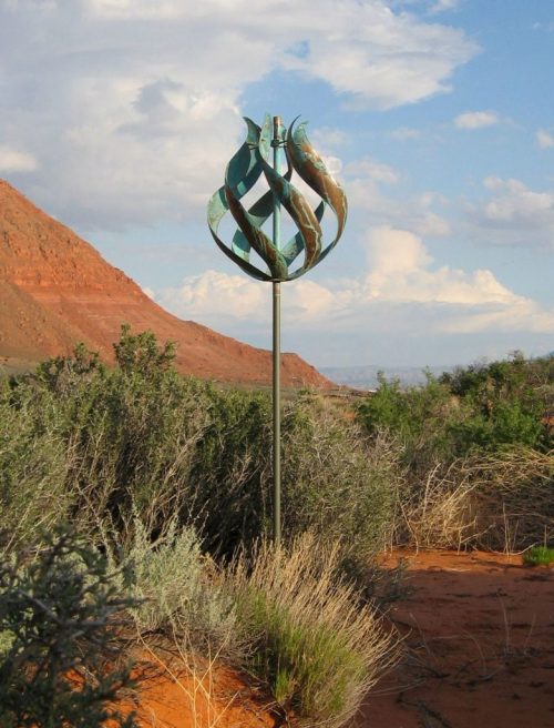 Tulip wind Sculpture by Lyman Whitaker in a desert setting.