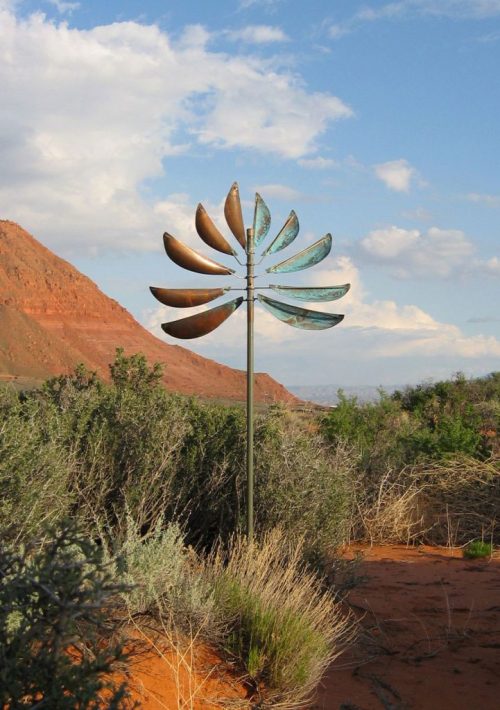 Guardian Angel Wind Sculpture by Lyman Whitaker in a desert setting.