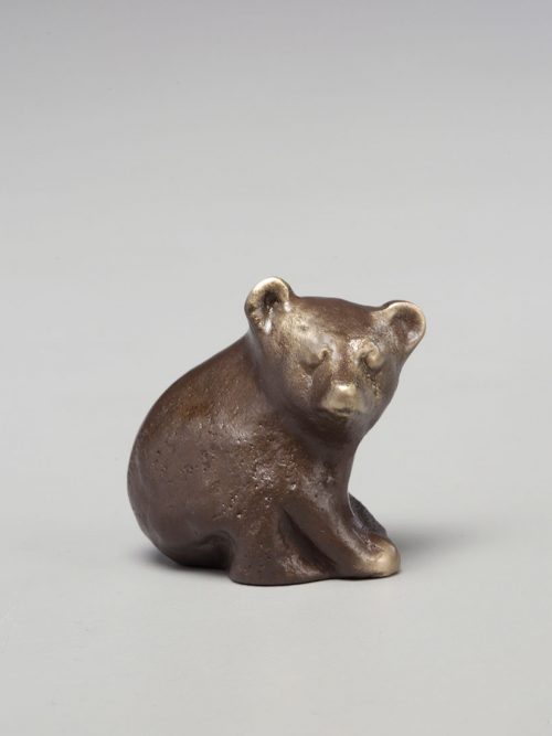 Cast bronze bear cub sculpture by Scott Nelles.
