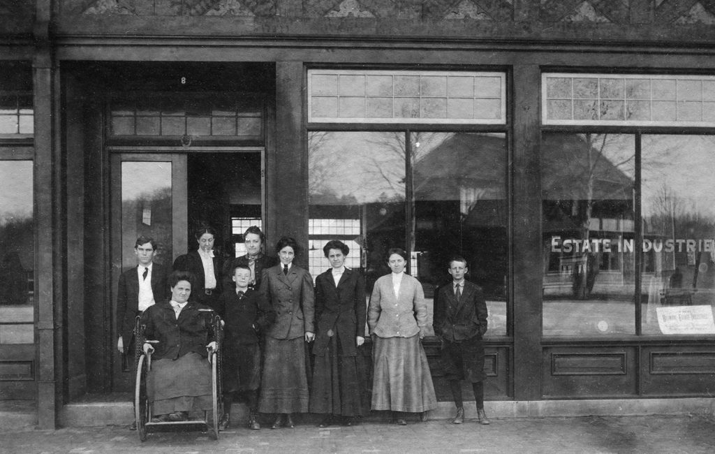 Standing in the doorway, left to right, Charlotte Yale and Eleanor Vance in front of Biltmore Estate Industries.