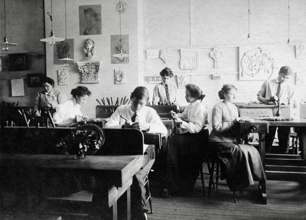 Archival photo of the woodcarving shop at Biltmore Estate Industries in Asheville, NC.