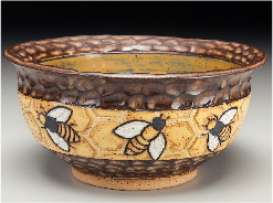 Ceramic bee bowl available for sale at Gallery of the Mountains in Asheville.