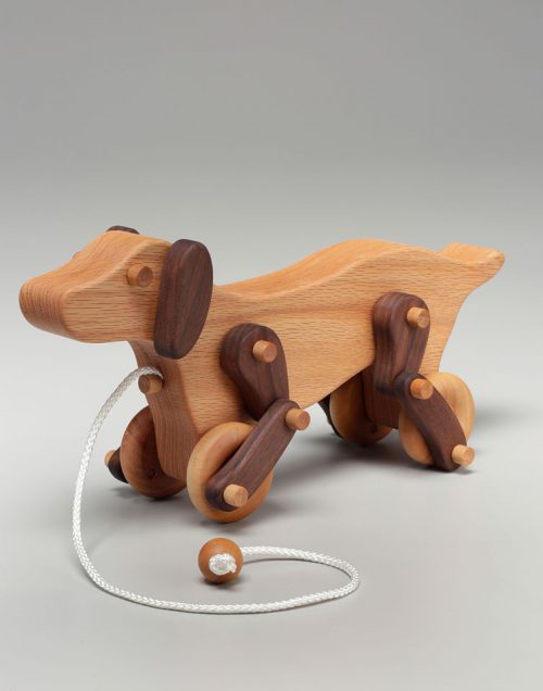 Pull dog toy handcrafted from white oak and walnut by East Laurel Woodcrafts.