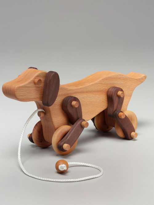 Pull dog toy handcrafted from white oak and walnut by East Laurel Woodcrafts.