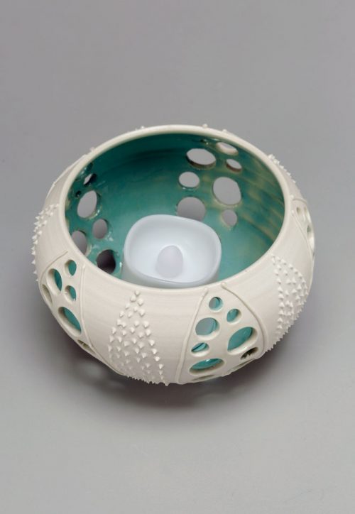 Porcelain sea urchin votive by Asheville potter Anja Bartels.