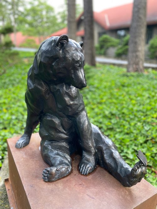 Bronze sculpture of a black bear by Roger Martin.