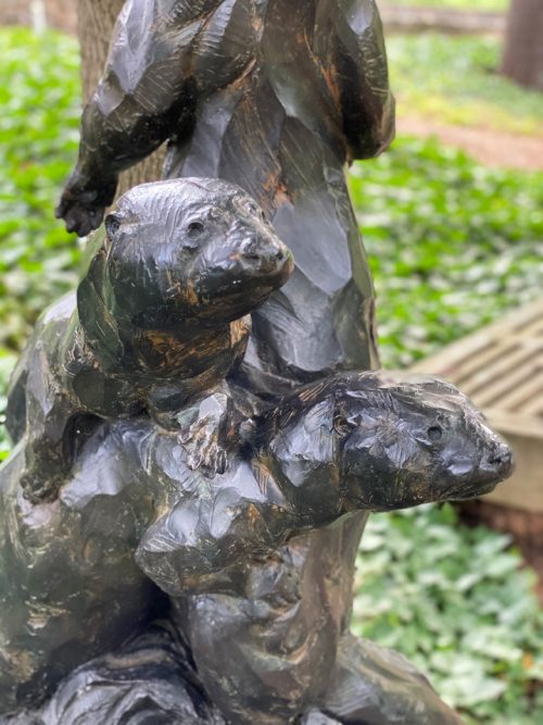 Bronze sculpture of otters by Roger Martin.