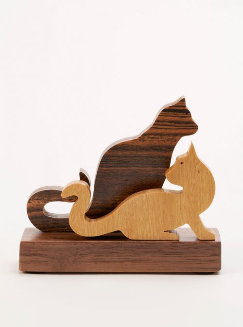Wooden sculpture of two cats by Jerry Krider.