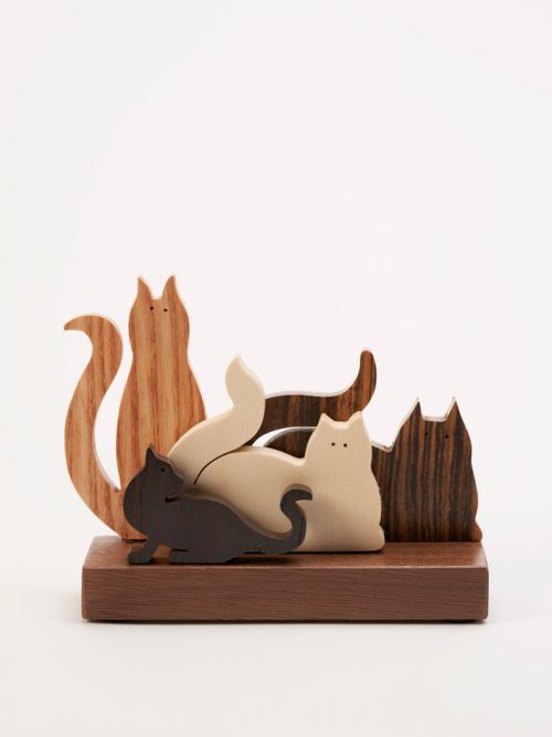 Wooden sculpture of four cats by artist Jerry Krider.