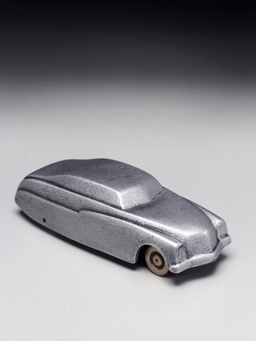 Small metal sculpture of a 1949 Mercury car handcrafted by Scott Nelles.