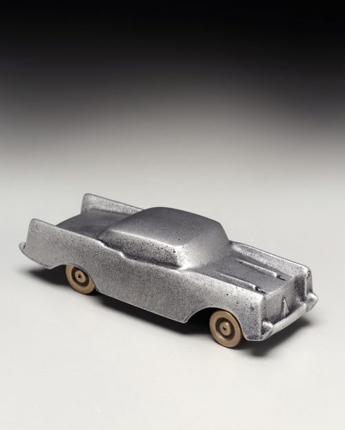 A small, metal sculpture of a 1957 Chevrolet handcrafted by Scott Nelles.