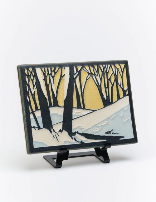 Ceramic tile of a snowscape at dawn by Motawi Tileworks in Ann Arbor, Michigan.