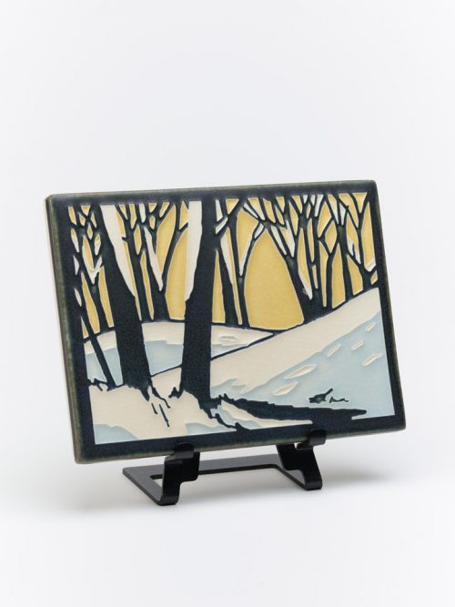 Ceramic tile of a snowscape at dawn by Motawi Tileworks in Ann Arbor, Michigan.