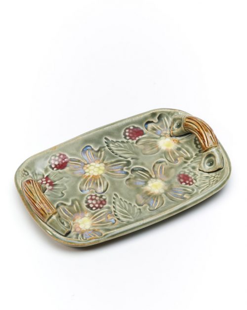 Handcrafted ceramic tray with a flower motif by North Carolina potter Vicki Gill.