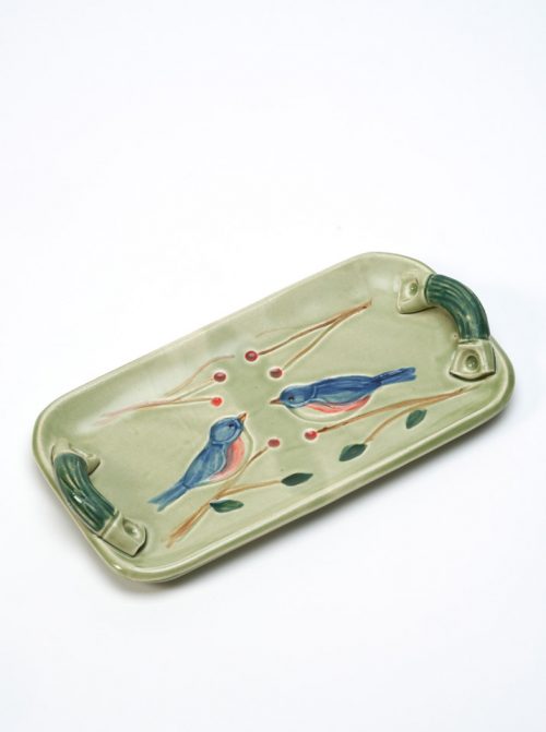 Stoneware tray with a bluebird motif by studio potter Vicki Gill.