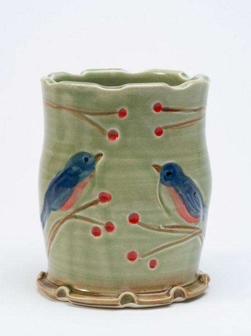 Handcrafted, wheel-thrown tumbler with a bluebird motif by North Carolina studio potter Vicki Gill.