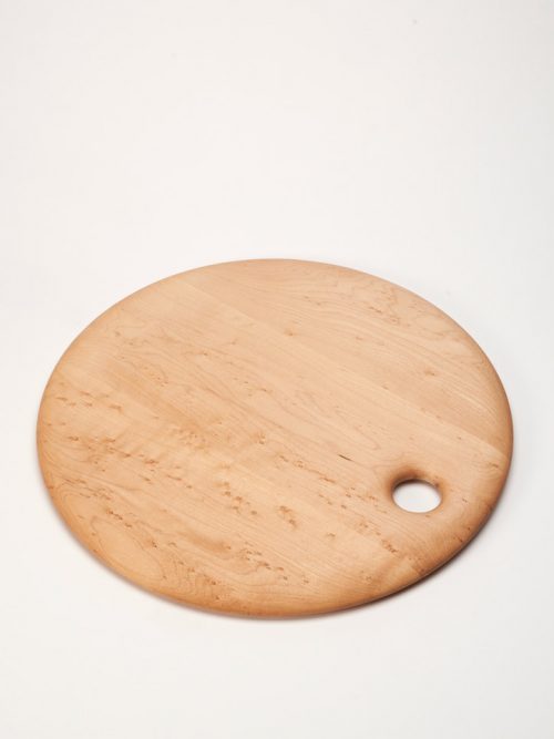 Round birds-eye maple cutting board handcrafted by Edward Wohl.