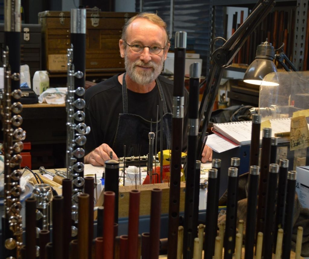 Wooden flute maker Crhis Abell in his Grovewood Village studio.