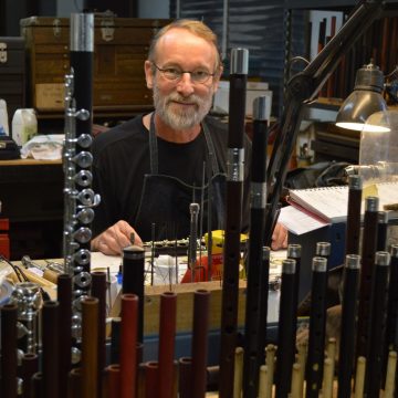Wooden flute maker Crhis Abell in his Grovewood Village studio.