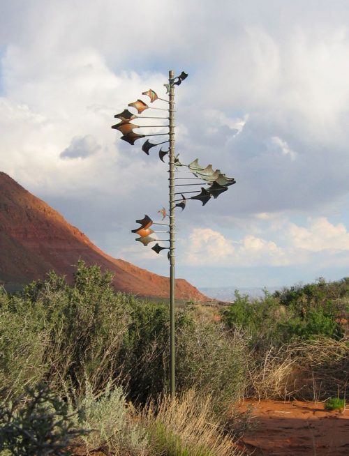 Single Helix Star Wind Sculpture by Lyman Whitaker in an outdoor setting.