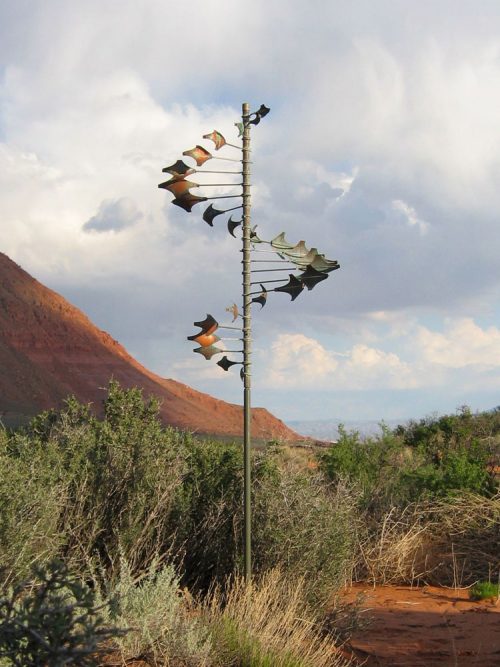 Single Helix Star Wind Sculpture by Lyman Whitaker in an outdoor setting.