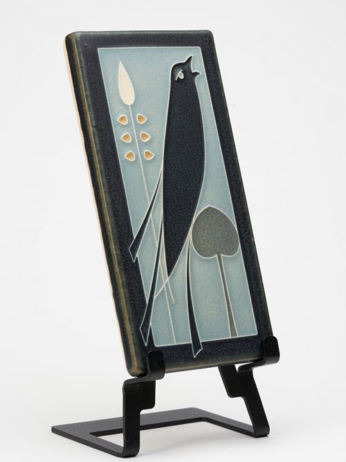 A Motawi Tileworks ceramic tile of a songbird inspired by a book jacket cover by Talwin Morris.