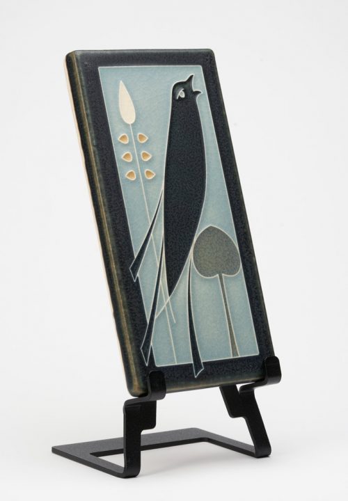A Motawi Tileworks ceramic tile of a songbird inspired by a book jacket cover by Talwin Morris.