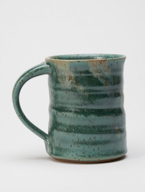 A stoneware mug with a everglade glaze handmade by potter Steve Tubbs.
