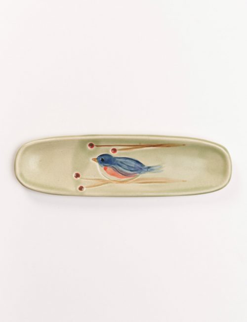 Handmade olive tray with a blue bird motif by North Carolina potter Vicki Gill.