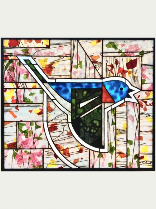 A stained glass window panel by Jacob Hinnenkamp featuring a Charley Harper bluebird design.