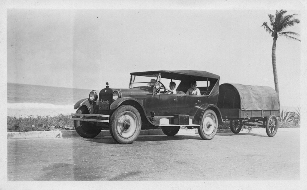 Vintage photograph of a 1923 REO Touring car at Palm Beach, FL.