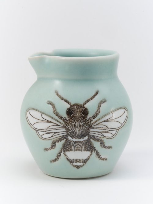 Porcelain creamer with a screen-printed bee handmade by SKT Ceramics.