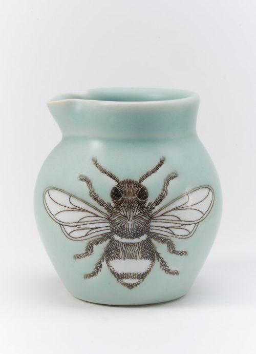 Porcelain creamer with a screen-printed bee handmade by SKT Ceramics.
