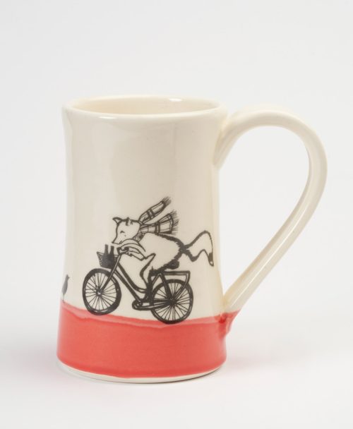 A red and white ceramic mug handmade by Darn Pottery that features a fox riding a bike with beers in his basket.