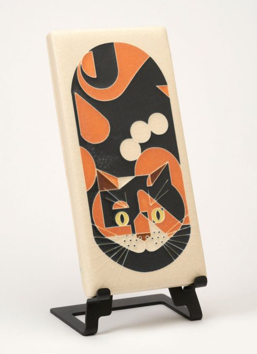 Ceramic calico cat art tile with a cream colored background by Motawi Tileworks.