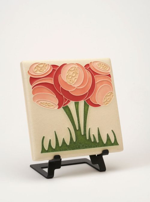 A handmade ceramic tile by Motawi Tileworks featuring a pink zoom blooms flower motif.