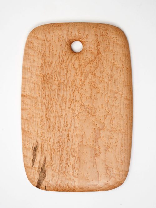 A birdseye maple breadboard handcrafted by Edward Wohl.