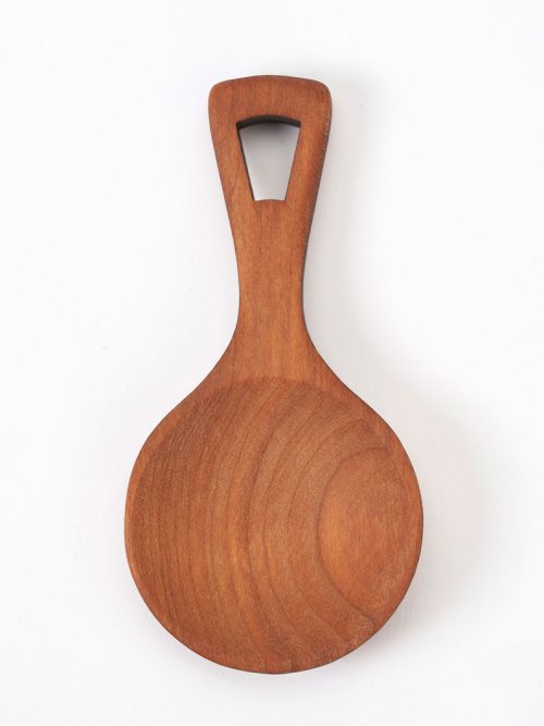 A wooden tea scoop handcrafted from cherry by Jonathan and Julia Simons of Moonspoon.