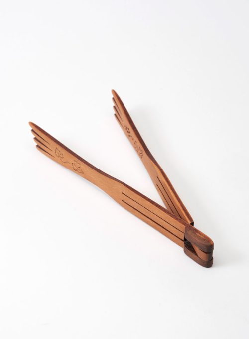 Small grapevine tongs in the open position, handcrafted from cherry wood by Moonspoon.