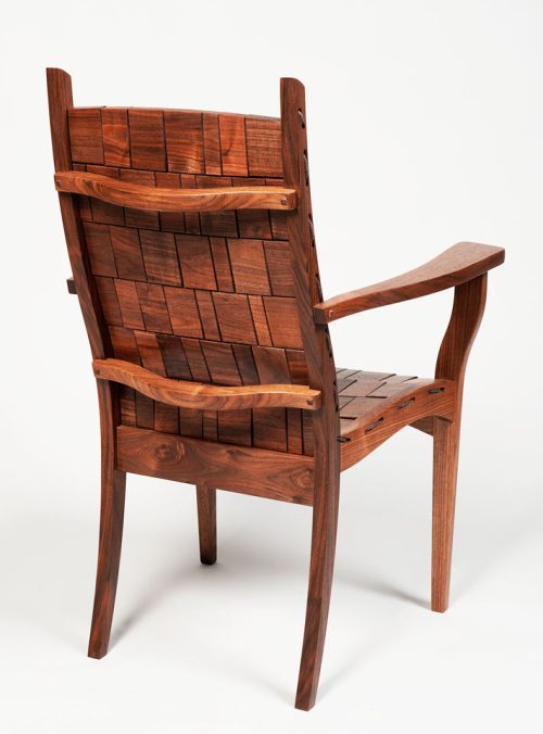 Teh backside of a walnut armchair handmade by Alan Daigre.