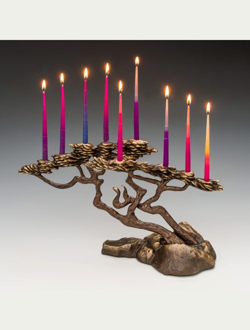 Bronze cypress menorah by Scott Nelles with lite candles.