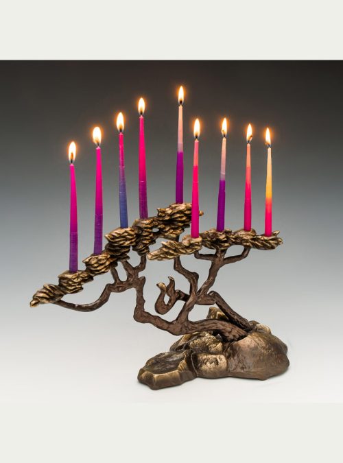 Bronze cypress menorah by Scott Nelles with lite candles.