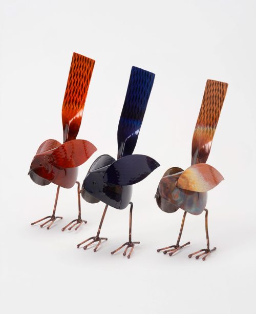 Three copper bird sculptures in red, blue, and copper by Haw Creek Forge.