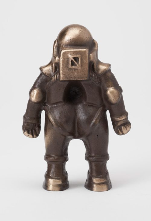 The backside of a small bronze spaceman sculpture by Scott Nelless.
