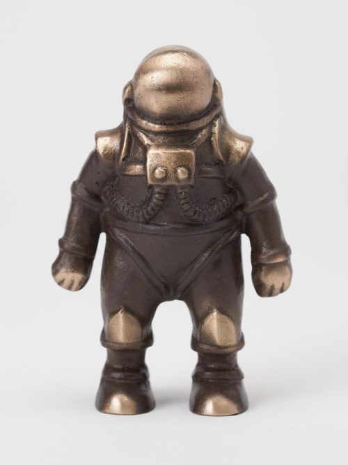 A small bronze spaceman sculpture by artist Scott Nelless.