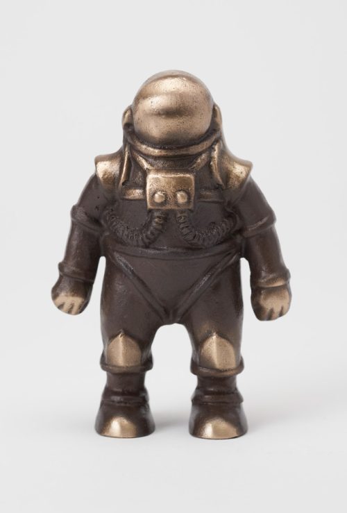 A small bronze spaceman sculpture by artist Scott Nelless.