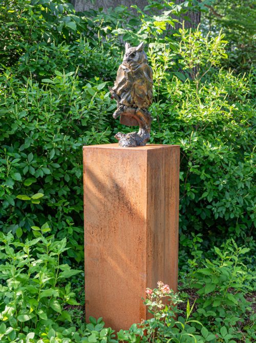 Bronze owl sculpture by North Carolina artist Roger Martin titled Moonshadow.