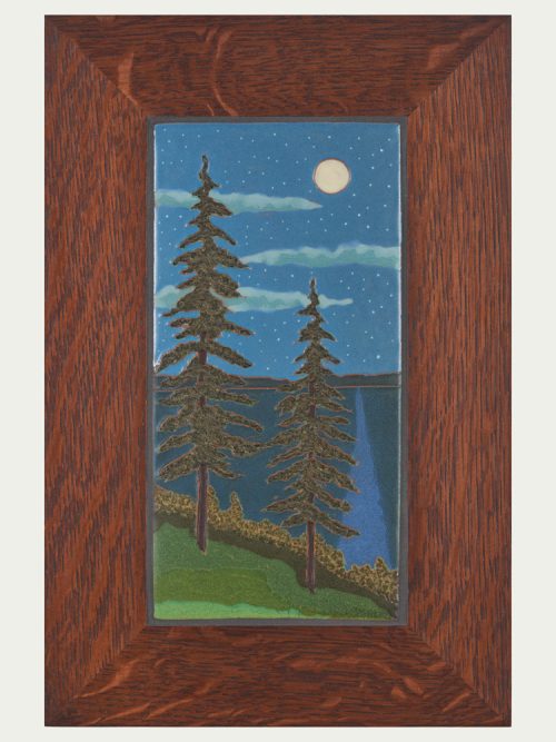A framed spruce moon tile by ceramic artist Jonathan White.